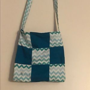 A light/dark blue handmade bag